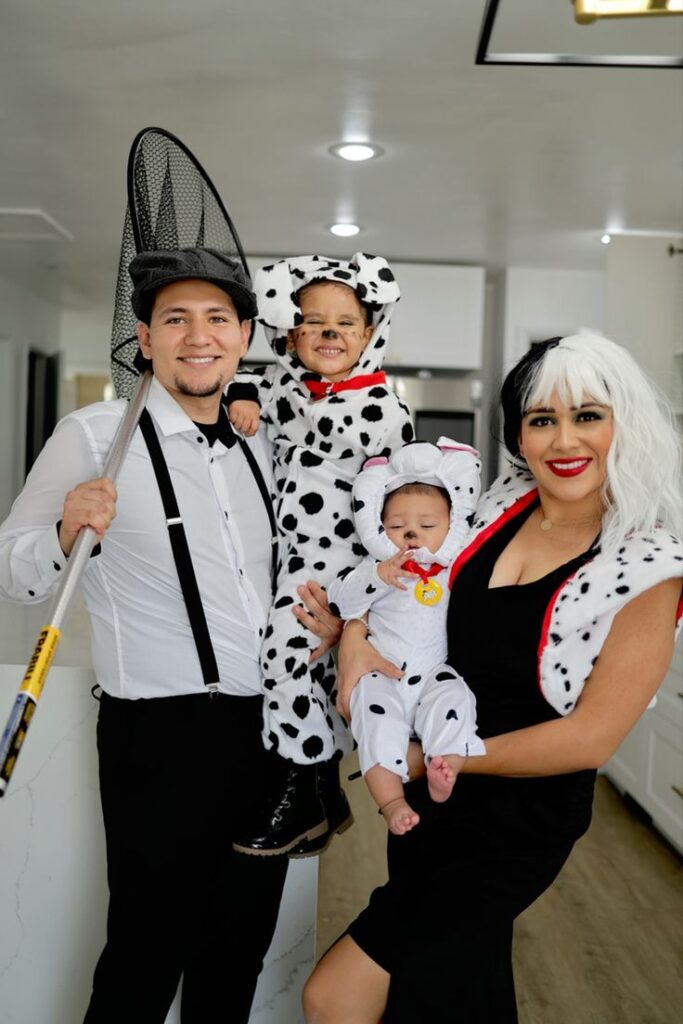 a family dressed up in 101 Dalmatians costumes