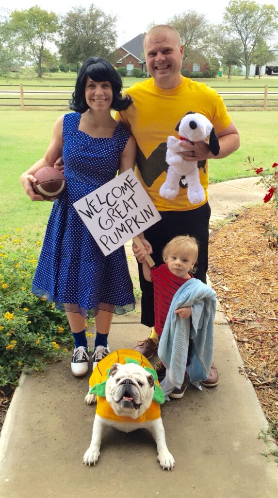 a family dressed up in Charlie Brown themed costumes