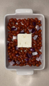 seasoned and unroasted cherry tomatoes and feta