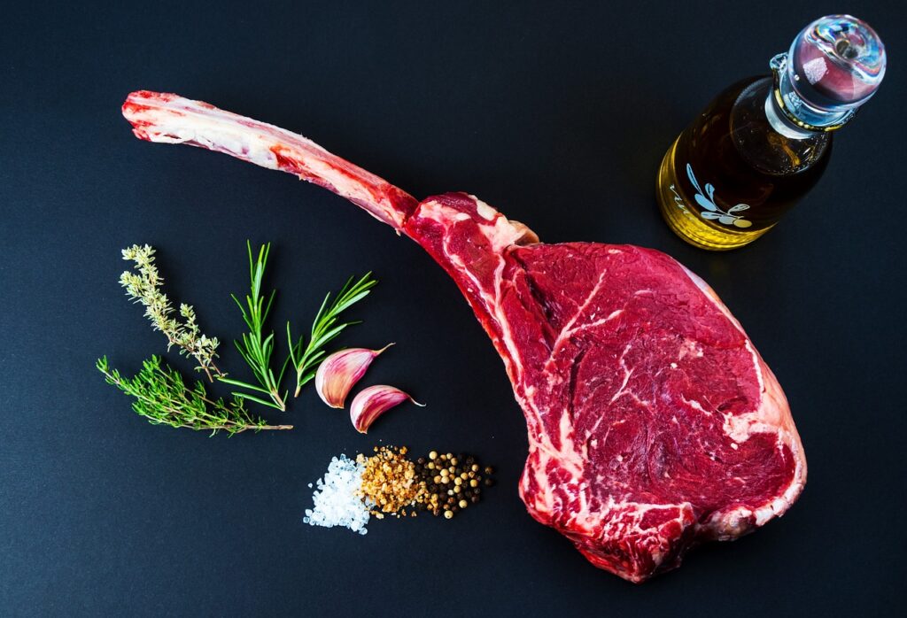 tomahawk steak with herbs and oil