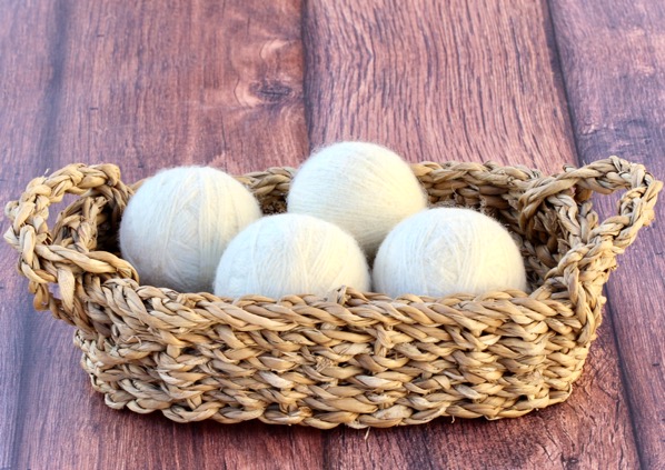 homemade wool dryer balls in a basket